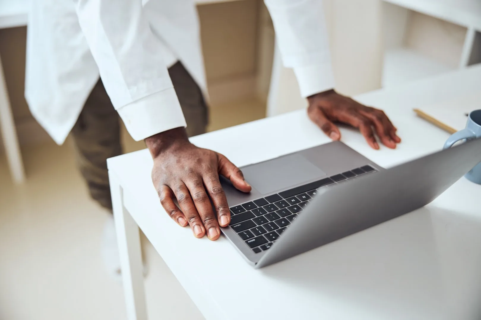 Professional using a laptop in an office