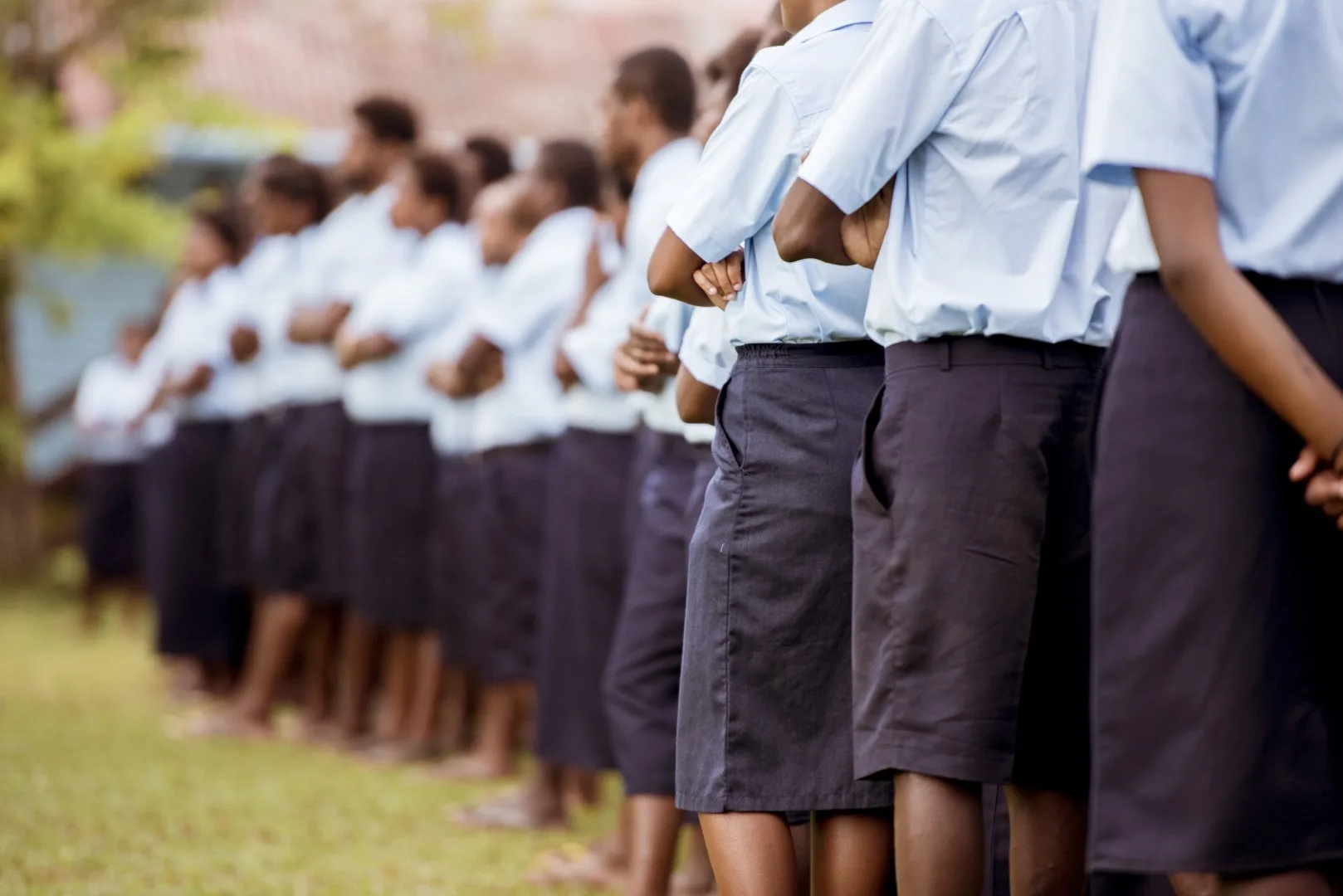 Students standing together in school uniforms