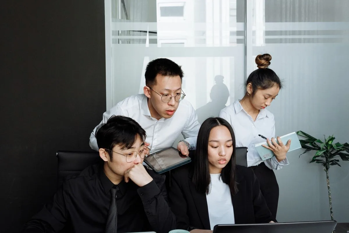 Project team reviewing information together in an office